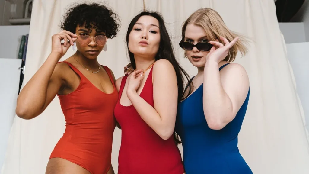 Second-wave feminism: Three women in swimsuits posing for a photo