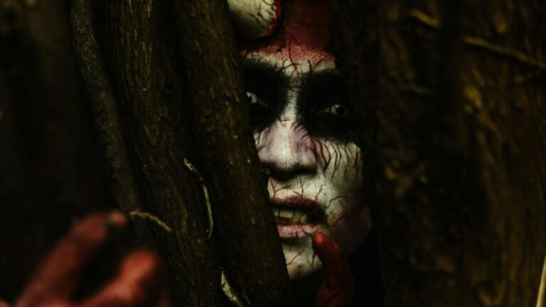 Evil in culture: a man dressed a horned demon with painted face