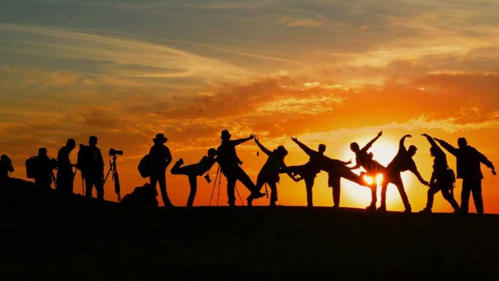 German War Crimes: a group of people having fun and watching sunset