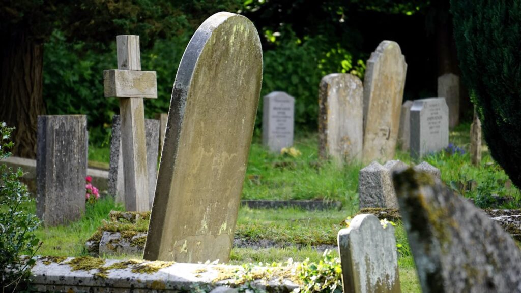 What do we regret: an old cemetery with decrepit tombstones and a cross