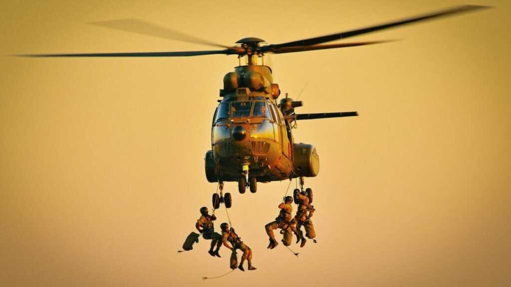 Russia in Africa: Soldiers descend from a military helicopter during a training exercise at sunset