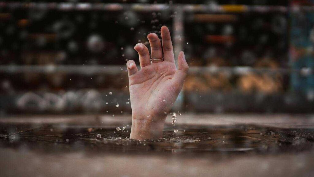 Death on Demand.
A hand emerging from water. Illustrative photo. Photo by Dimhou/Pixabay.