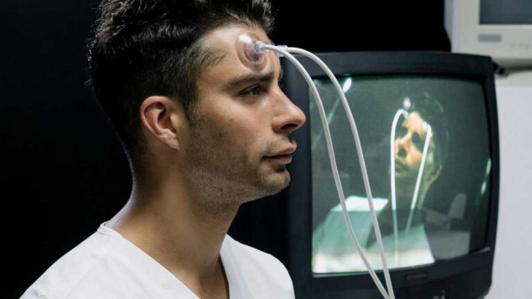 Mind uploading to a computer. Photo by cottonbro studio/pexels. A man with wires connected to his head