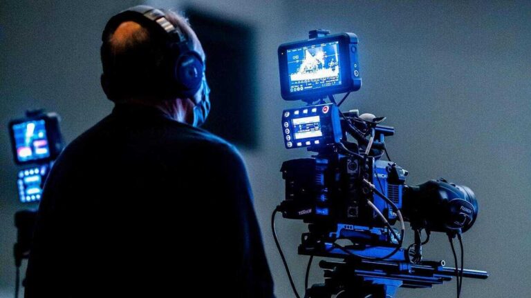 Media trust. A man with camera.