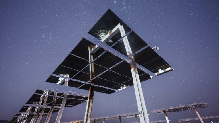 Solar panels at night: a solar panel with a starry sky in the background.