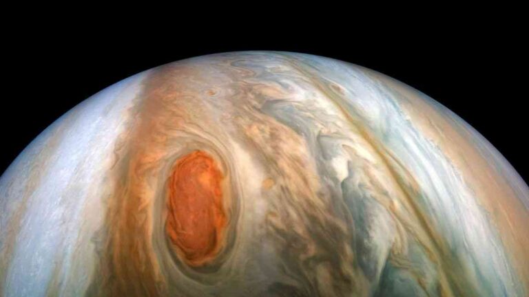 A close-up image of Jupiter's swirling, colorful surface, showcasing its iconic Great Red Spot and turbulent atmosphere. Fot. Kevin M. Gill / CC BY 2.0
