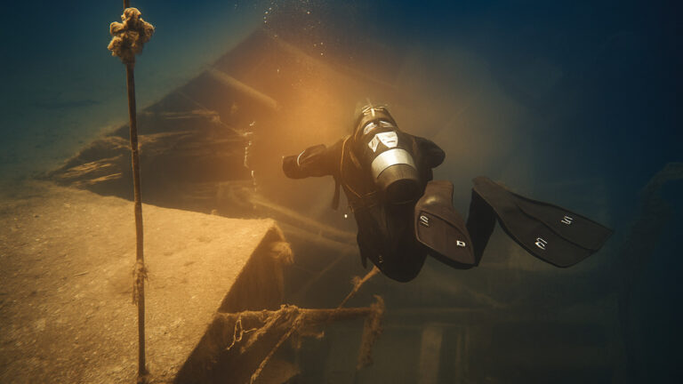 Diver examines Cleopatra's sunken port – the possible location of Cleopatra's tomb in Egypt, an archaeological discovery.