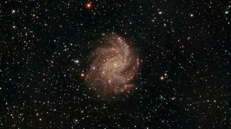 Bright stars in a dark sky with a golden center.