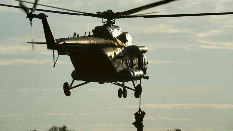 Illustrative photo. A military helicopter during a special operation—a US Special Operations soldier exiting the aircraft during a high-speed insertion.