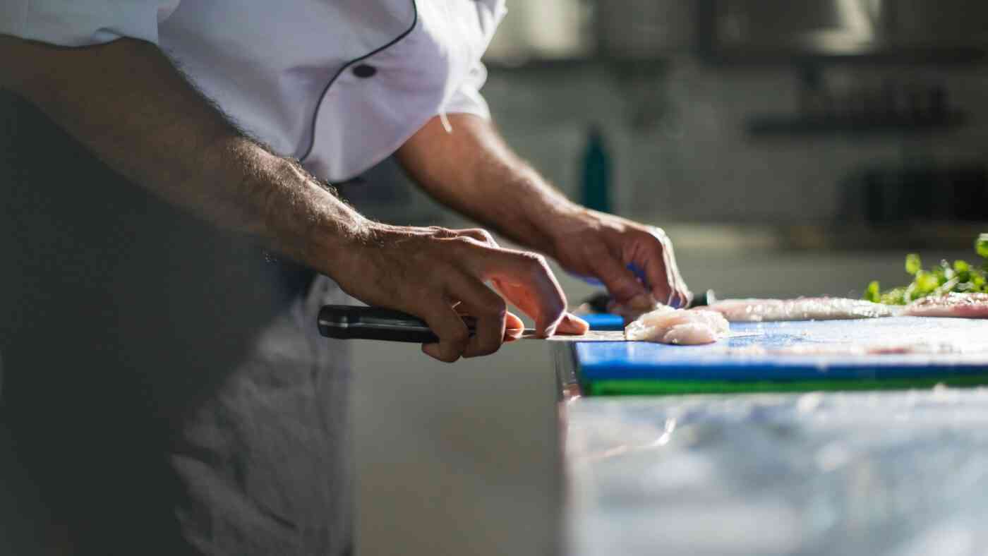 Fugu kimo, a forbidden Japanese delicacy, ranks among the most dangerous dishes in the world. Pictured: A chef precisely slicing the fish.