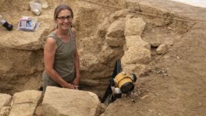 The Pylos Combat Griffin tomb reveals the ancient world. Pictured: a researcher posing inside the archaeological excavation.