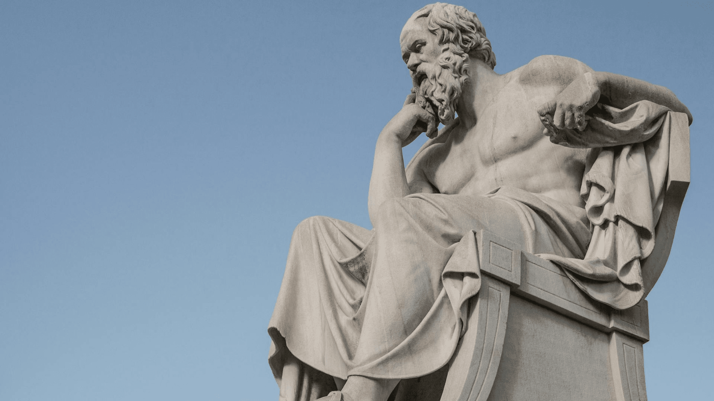 Sculpture of a pensive ancient Greek philosopher, reflecting on the ancient Greek arche—water, fire, and numbers as the building blocks of the world.