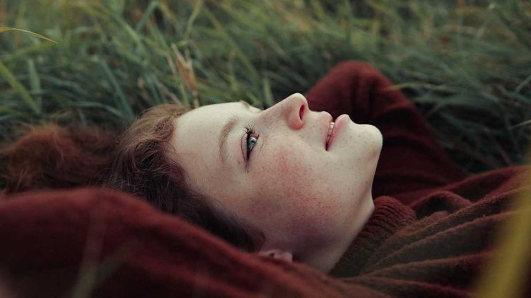 Escape into Daydreams: A girl lies in the grass, gazing at the sky and drifting into reverie