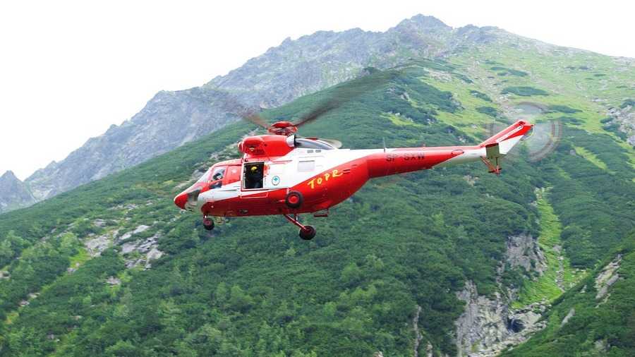 Halny Wind: A Tatra Volunteer Search and Rescue helicopter against a mountain backdrop