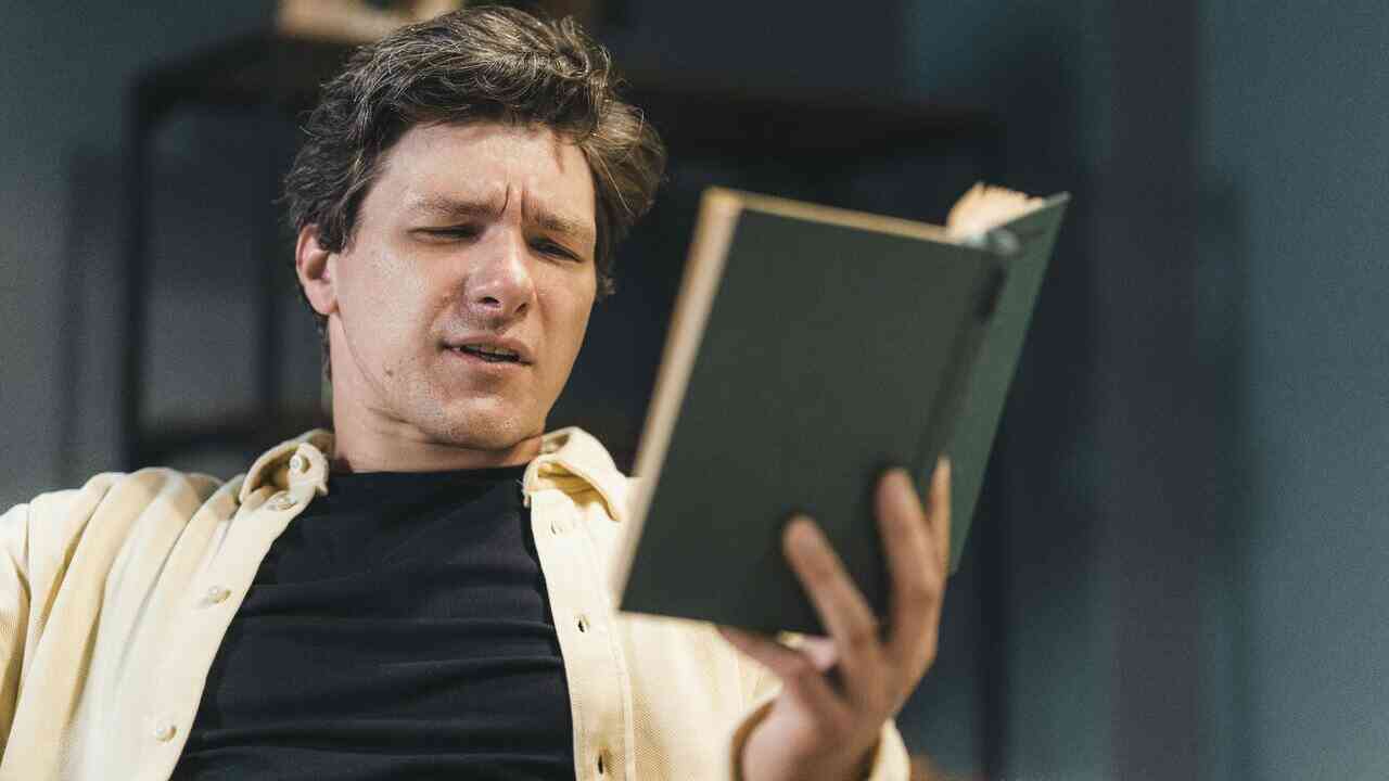 A man reading a book — AI-written books and how they are received.