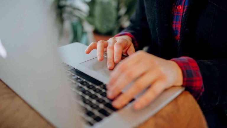 A man’s hands on a keyboard, as the question returns: can truth still overcome falsehood online?