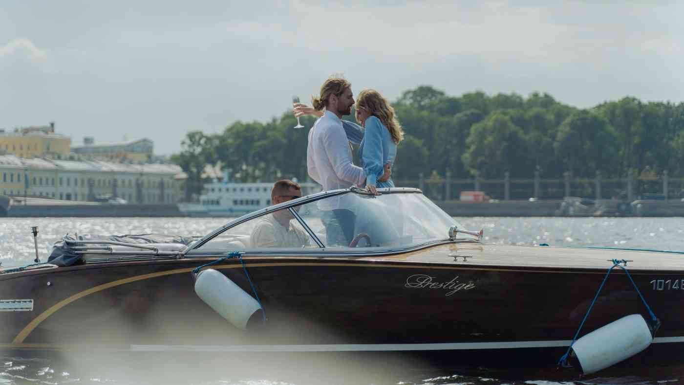 A man and a woman on a boat mask their fear of rejection