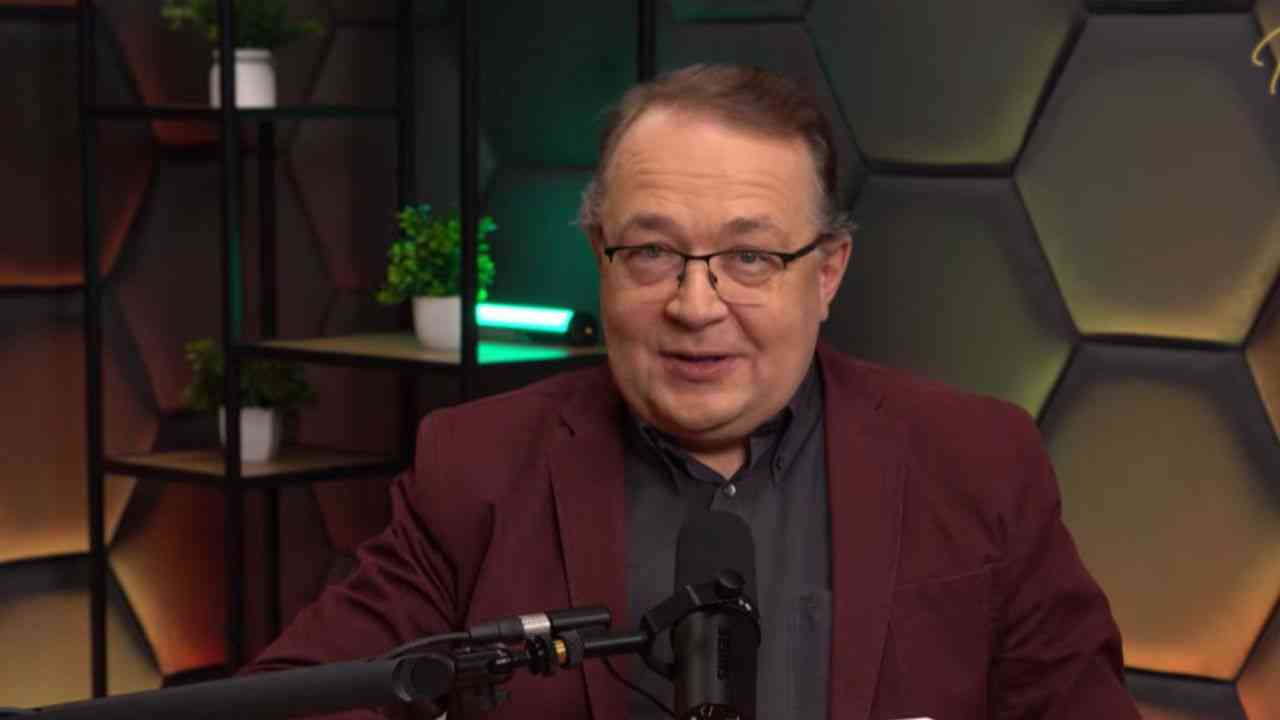 Piotr Gociek on the new Evil Empire. Close-up of a man’s face against a dark background.