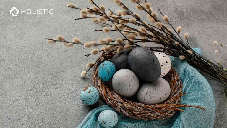 A basket of Easter eggs and willow branches against a light background, a symbol of Easter and its meaning today
