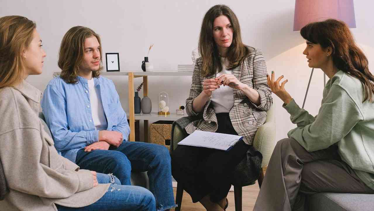 Several participants sharing their vulnerabilities within the crucible of a group therapy session