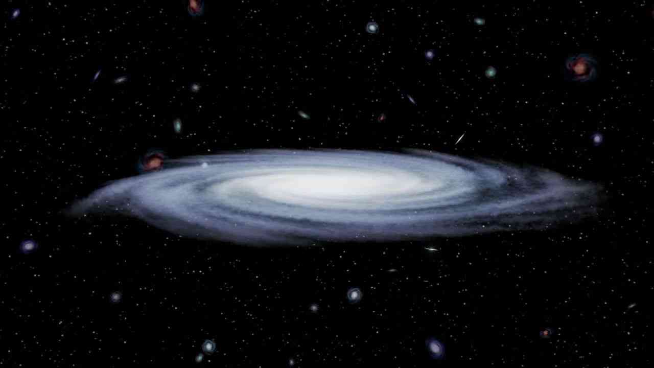 A luminous white circle contrasted against a deep black cosmic background scattered with stars, illustrating the structural formation of a black hole.
