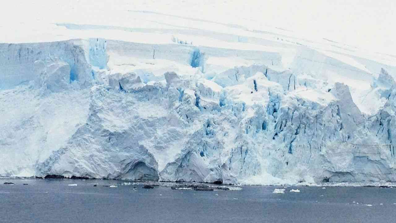 The image shows Antarctica’s melting glaciers.