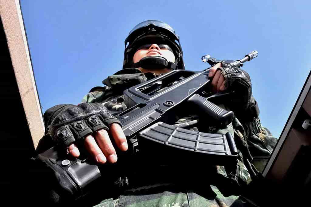 This photo taken on February 27, 2017 shows a Chinese military policeman attending an anti-terrorist oath-taking rally in Hetian, northwest China's Xinjiang Uygur Autonomous Region.  Islamic State militants from China's Uighur ethnic minority have vowed to return home and 