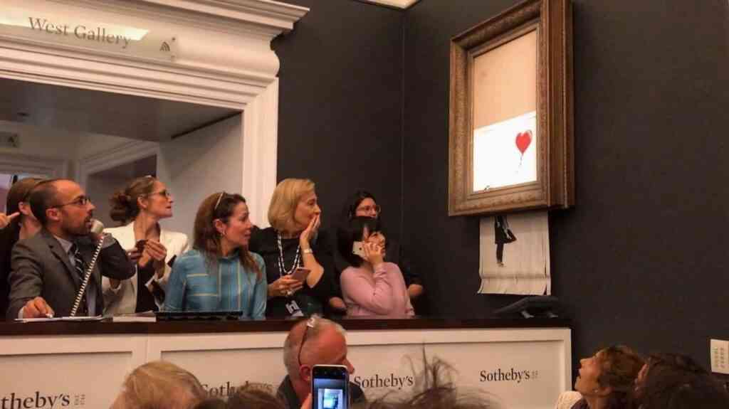 Non Exclusive: A rare piece of artwork from Banksy went up for auction this evening only to self-destruct moments after it was sold. Banksy???s iconic ??sGirl with Balloon??? painting was auctioned at Sotheby???s in New York City on Friday night. However, almost immediately after the record-setting bid of $1.1 million was announced aloud, an alarm was triggered inside the frame and proceeded to shred the painting to pieces. The auction house was forced to admit it got Banksy-ed. ------- DISCLAIMER: BEEM does not claim any Copyright or License in the attached material. Any downloading fees charged by BEEM are for BEEM's services only, and do not, nor are they intented to, convey to the user any Copyright or License in the material. By publshing this material, the user expressly agrees to indemnify and to hold BEEM harmless from any claims, demands, or causes of action arising out of or connected in any way with user's publication of the material.