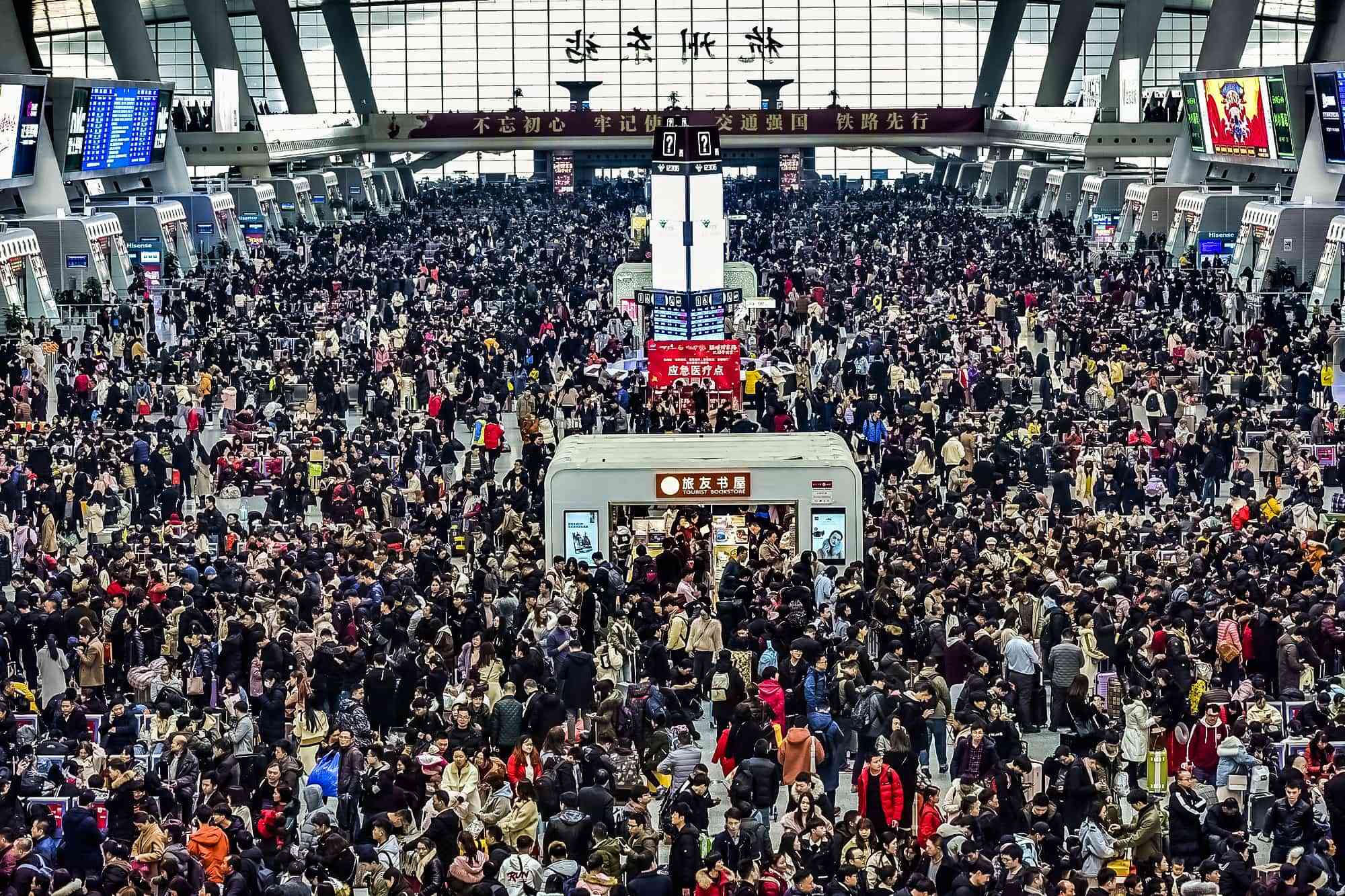 Passengers wait for their trains during the Spring Festival travel rush