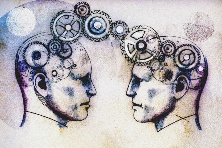 Two men's heads face to face connected by cogs