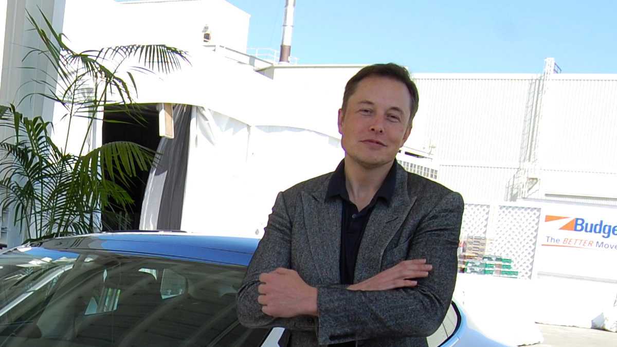 Grok Elona Muska: Elon Musk w przestrzeni wystawowej fabryki Tesla